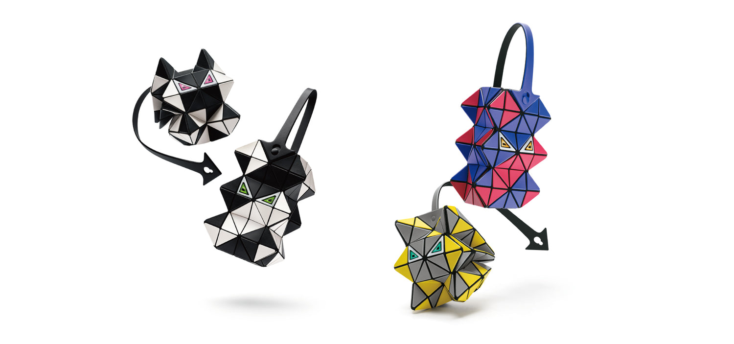 Geometric bags in black, blue, and yellow on a white background