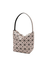The VALLEY by BAO BAO ISSEY MIYAKE is a light pink, geometric handbag with black triangular lines, a thick single shoulder strap, and a structured gusseted design that stands upright for a modern, angular look.
