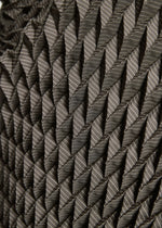 Close-up of the TYPE-O STOLE by A-POC ABLE ISSEY MIYAKE, showcasing its geometric 3D pleated pattern in grey tones with textured folds and bold diagonal lines.