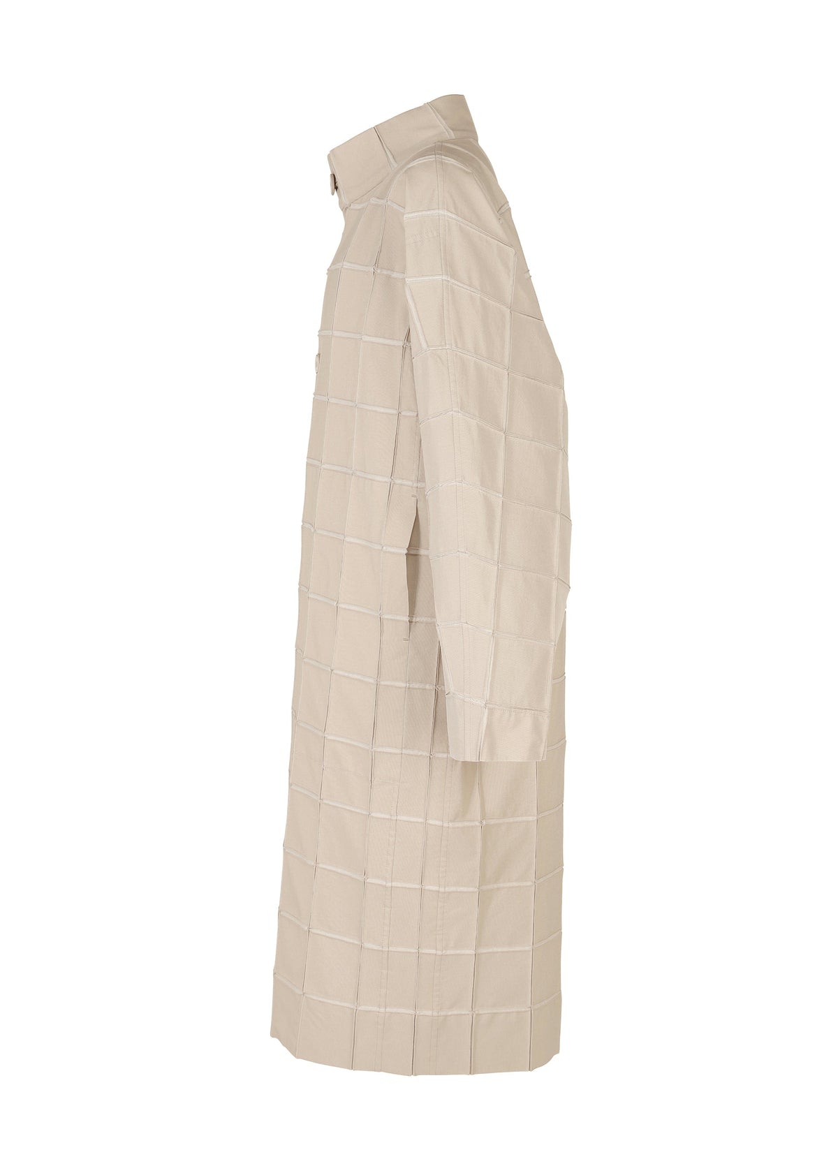 The TYPE-O 002 by A-POC ABLE ISSEY MIYAKE is a beige, knee-length shirt dress with long sleeves, a collar, and a grid pattern, crafted from lightweight stretch fabric and shown from the side. view 4 of 10