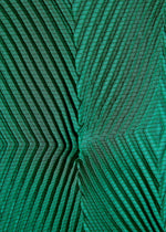Close-up of TYPE-O 007 by A-POC ABLE ISSEY MIYAKE: green recycled polyester pants fabric with a geometric zigzag pattern and textured, raised chevron lines across the surface.