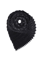 A black, intricately folded TYPE-Ⅶ Kouzoshi project 002 fabric by A-POC ABLE ISSEY MIYAKE is artfully arranged in a spiral, its pointed geometric edges recalling the sculptural elegance of an ISSEY MIYAKE collaboration stole—presented against a white background. - NAVY-HUED （no.79）