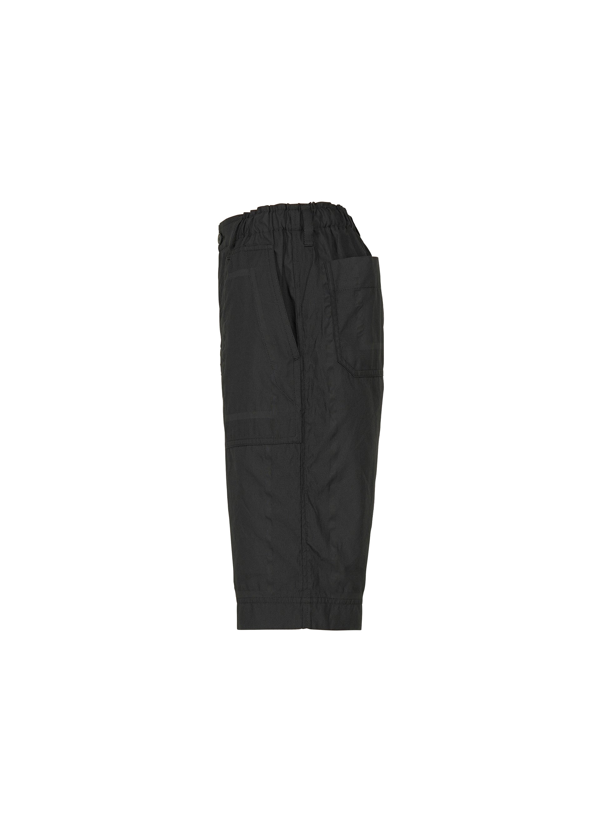 Zoomed view The TYPE-U 001 black cargo shorts by A-POC ABLE ISSEY MIYAKE are shown in a side view, highlighting their large pockets and elastic waistband. These wrinkle-resistant shorts are presented against a plain white background.