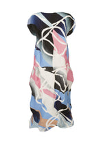 The TYPE-XV SOAR NY project 001 dress by A-POC ABLE ISSEY MIYAKE is sleeveless and pleated, featuring an abstract blue, pink, white, and black pattern with bold swirls and flowing lines inspired by Japanese aesthetics.