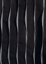 A close-up of TYPE-W 011 by A-POC ABLE ISSEY MIYAKE: vertically striped black and gray fabric with zigzag pleats, featuring a wrinkled, textured surface inspired by Steam Stretch techniques.
