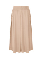 The TYPE-A 003 by A-POC ABLE ISSEY MIYAKE are beige, high-waisted, knee-length culotte shorts with wide legs and subtle pleats, crafted from lightweight A-POC-inspired tubular fabric for a relaxed look.