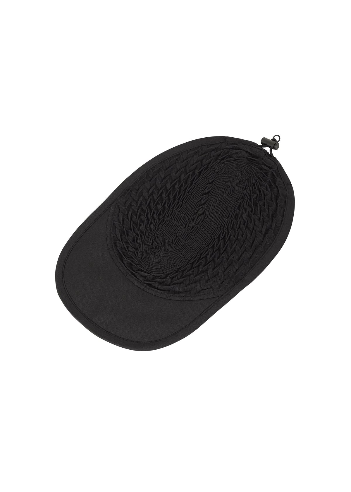 Zoomed view The TYPE-O CAP by A-POC ABLE ISSEY MIYAKE is a black, washable hat with a woven oval crown, solid brim, small loop near the top edge, and adjustable fit, shown lying flat on a white background.