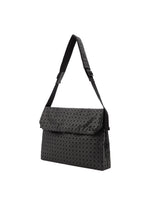 The FROGGY shoulder bag from BAO BAO ISSEY MIYAKE features a geometric triangular pattern, an adjustable strap, and a flap closure in black. Offering ample storage, it is displayed against a white background.