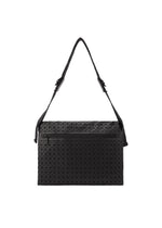 The BAO BAO ISSEY MIYAKE FROGGY shoulder bag in black showcases a geometric triangular pattern and offers ample storage with a zippered front pocket and an adjustable strap, displayed against a plain white background.