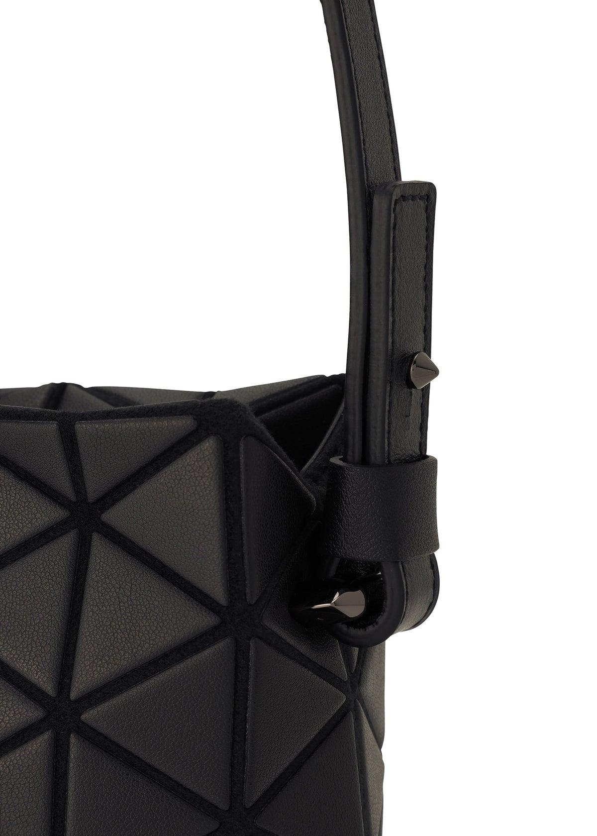Close-up of the TONNEAU MATTE by BAO BAO ISSEY MIYAKE, a black barrel-shaped mini handbag with a geometric, triangular pattern and textured matte surfaces, featuring a sturdy strap with metal studs for a modern, structured look. view 3 of 6