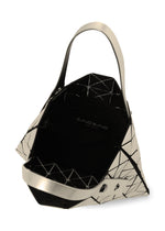 The BAO BAO ISSEY MIYAKE PLATINUM shoulder bag features a geometric pattern with metallic triangles, a shiny finish, two sturdy handles, and a black fabric-lined interior with a zippered pocket.