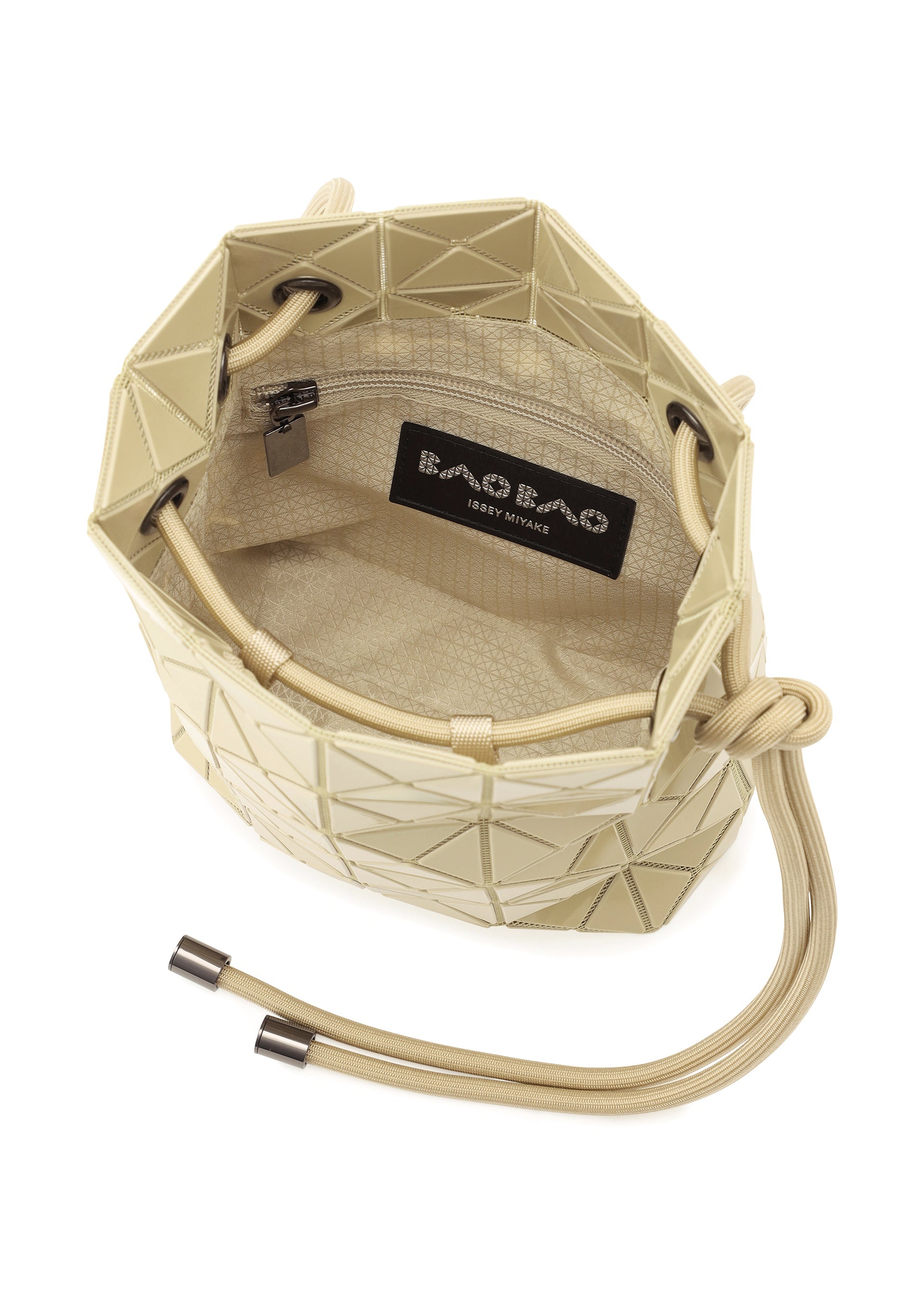 Zoomed view The WRING ONE-TONE by BAO BAO ISSEY MIYAKE is a beige geometric-patterned bucket bag with a drawstring closure, textured interior, and black logo label inside; use as a chic shoulder bag or drawstring pouch.