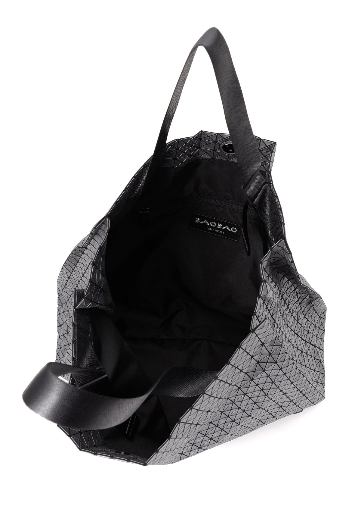 The CART REFLECTOR tote by BAO BAO ISSEY MIYAKE features a geometric gray metallic design, black adjustable handles, and an open view highlighting its spacious black interior with a visible label inside. view 3 of 6