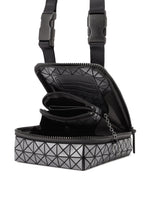 The BEETLE REFLECTOR by BAO BAO ISSEY MIYAKE is a black and gray square crossbody bag featuring a geometric pattern, reflective material, an attached coin pouch inside, and adjustable buckle strap closures.