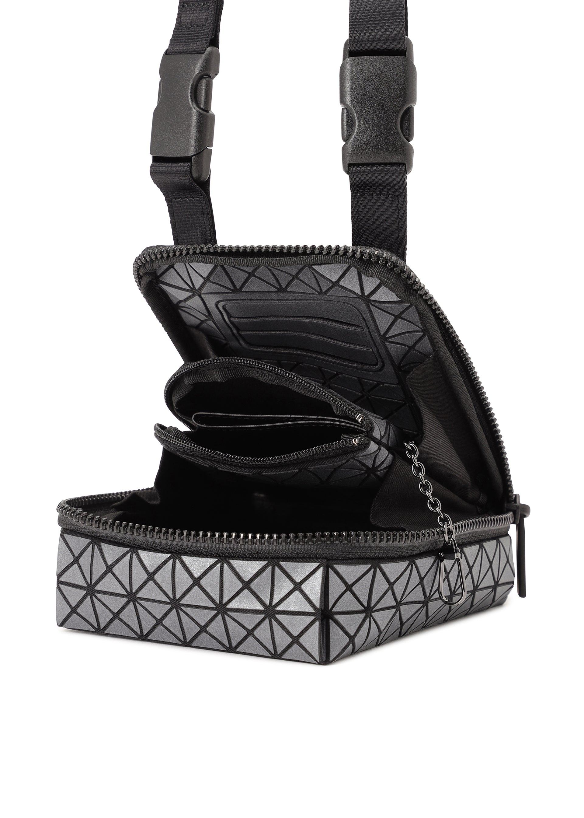 Zoomed view The BEETLE REFLECTOR by BAO BAO ISSEY MIYAKE is a black and gray square crossbody bag featuring a geometric pattern, reflective material, an attached coin pouch inside, and adjustable buckle strap closures.