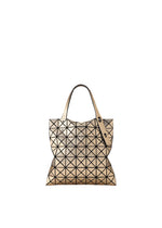 The PLATINUM tote bag by BAO BAO ISSEY MIYAKE features a geometric beige design with black triangle patterns, two handles, and a fabric grain texture, shown on a white background. - LIGHT BRONZE （no.90）