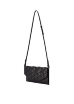 The TONNEAU MATTE by BAO BAO ISSEY MIYAKE is a black shoulder bag with a geometric pattern, leather-like finish, sleek modern design, and a long adjustable strap, displayed on a plain white background.