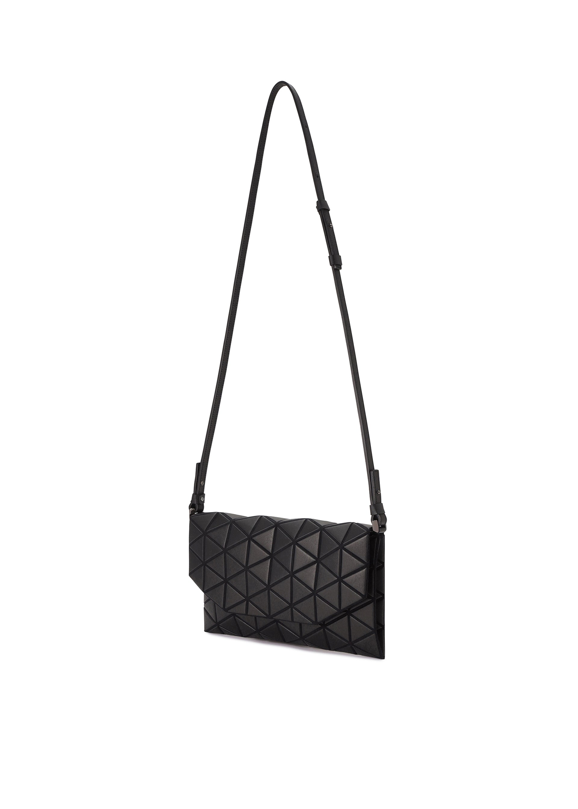 Zoomed view The TONNEAU MATTE by BAO BAO ISSEY MIYAKE is a black shoulder bag with a geometric pattern, leather-like finish, sleek modern design, and a long adjustable strap, displayed on a plain white background.