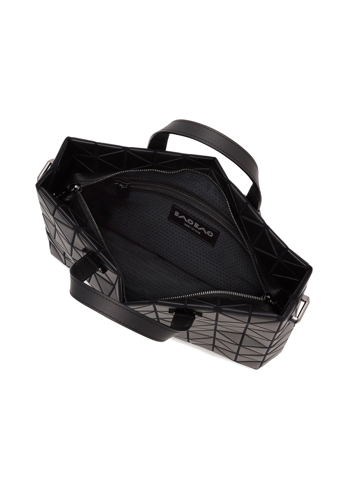 Top view of the BAO BAO ISSEY MIYAKE TONNEAU MATTE: an open black geometric-patterned handbag with two handles, showing a zippered main compartment that fits A4 items and displays the interior label. view 5 of 6