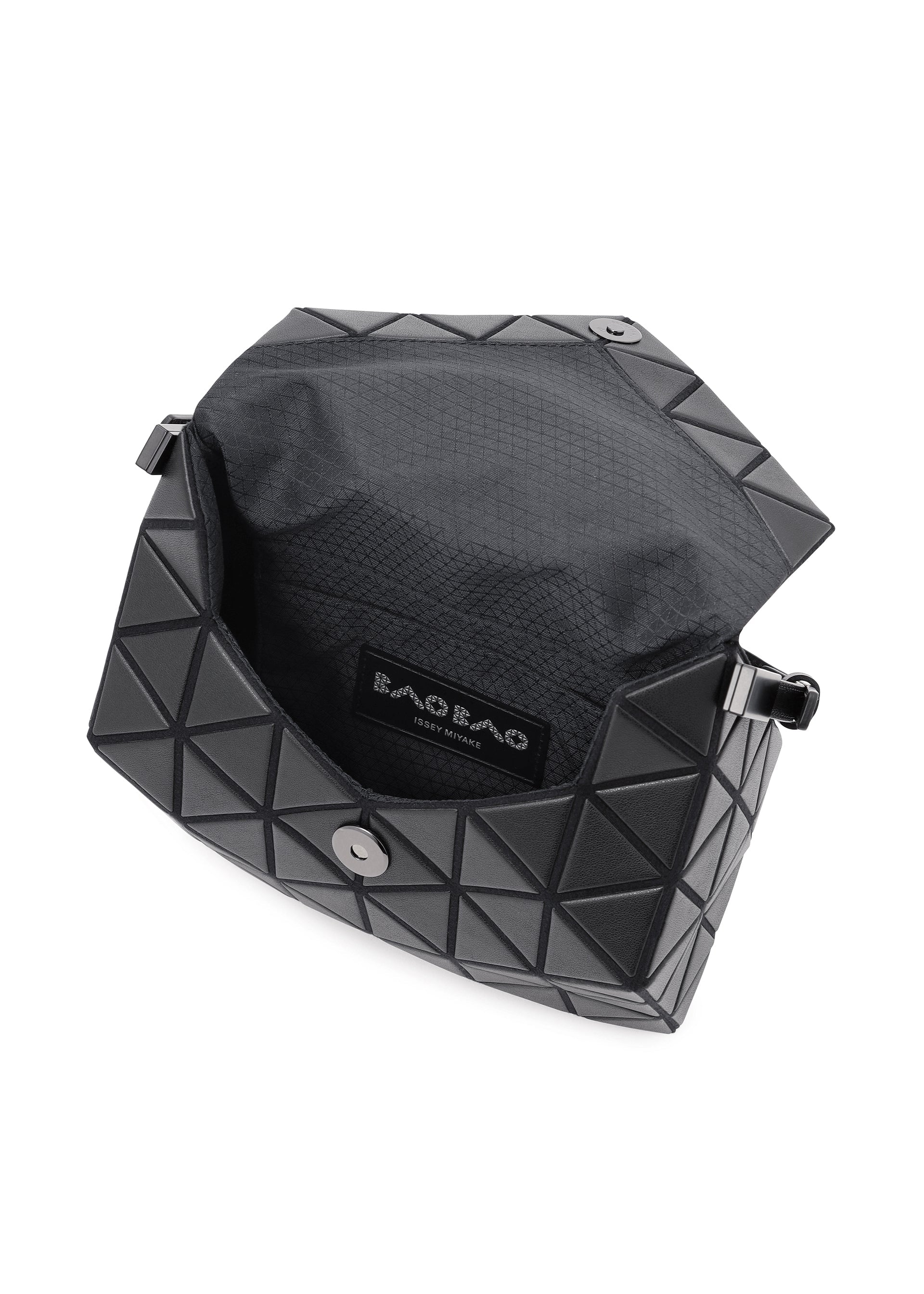 Zoomed view The black BAO BAO ISSEY MIYAKE TORSO shoulder bag features a geometric, leather-like exterior, stylish curved shape, magnetic snap closure, and opens to reveal a fabric-lined interior with the Bao Bao label visible.