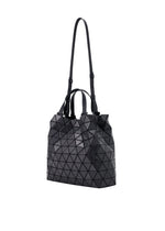 The CRYSTAL GLOSS tote by BAO BAO ISSEY MIYAKE is a black cowhide leather bag with a geometric triangular pattern, short handles, and an adjustable shoulder strap, shown on a white background.