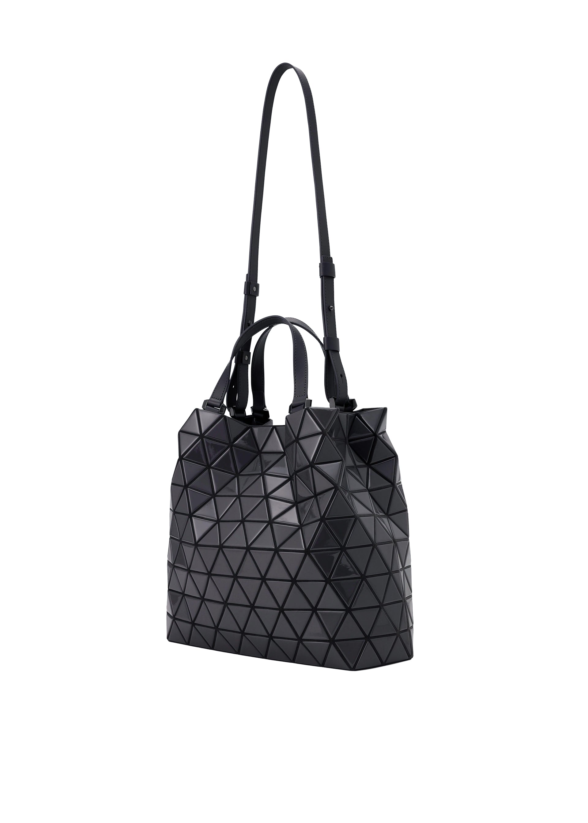 Zoomed view The CRYSTAL GLOSS tote by BAO BAO ISSEY MIYAKE is a black cowhide leather bag with a geometric triangular pattern, short handles, and an adjustable shoulder strap, shown on a white background.