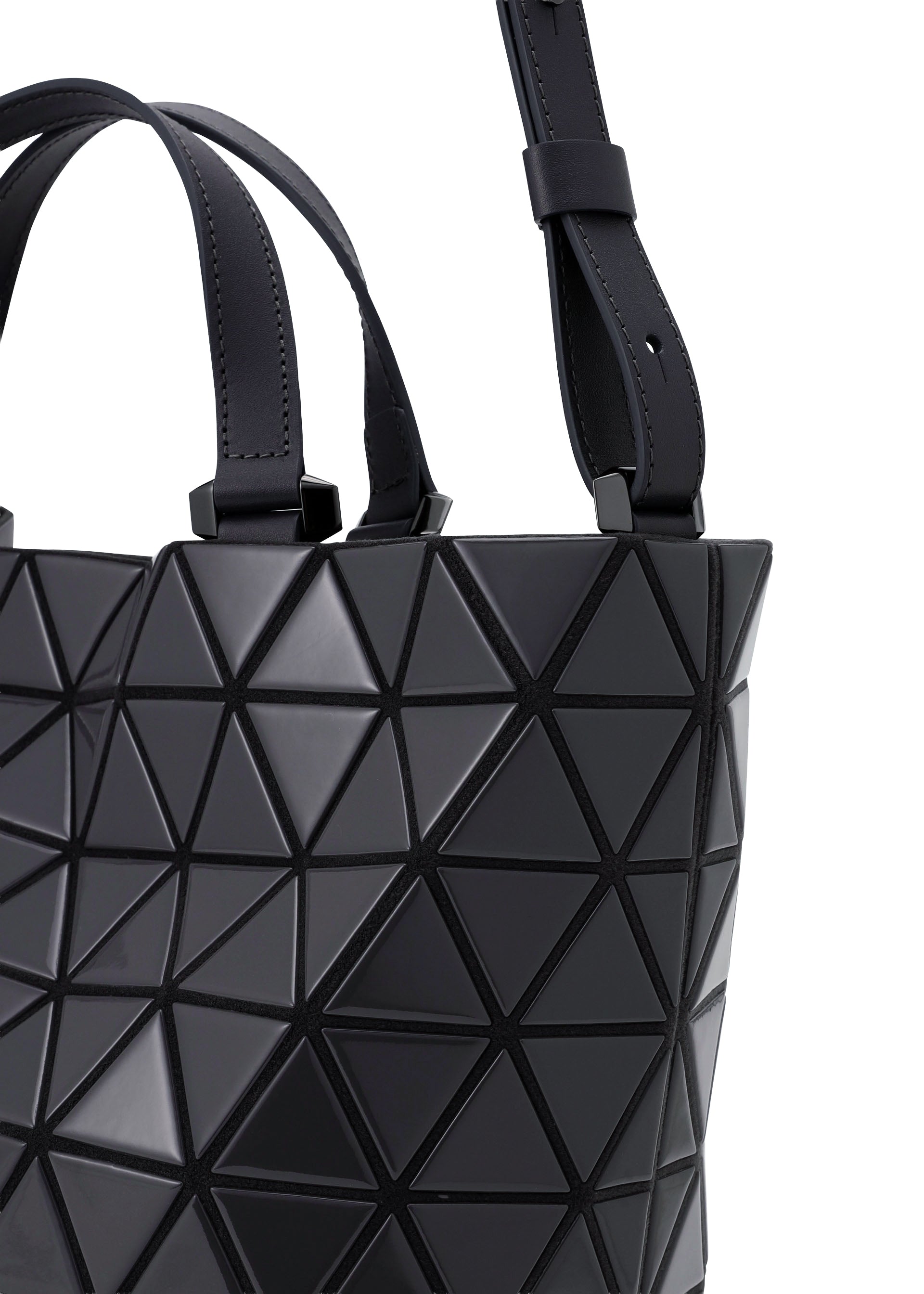 Zoomed view Close-up of the BAO BAO ISSEY MIYAKE CRYSTAL GLOSS handbag in black cowhide leather, showcasing a geometric triangular design with both a short handle and an adjustable long strap.