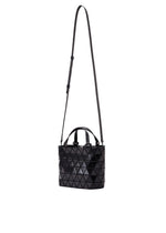 The CRYSTAL GLOSS mini handbag by BAO BAO ISSEY MIYAKE features a black geometric pattern, cowhide leather, two short handles, and a long adjustable shoulder strap, shown against a white background.