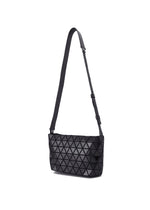 The CRYSTAL GLOSS shoulder bag by BAO BAO ISSEY MIYAKE features a glossy black enamel finish, adjustable leather strap, and a signature geometric triangular pattern, shown against a white background.