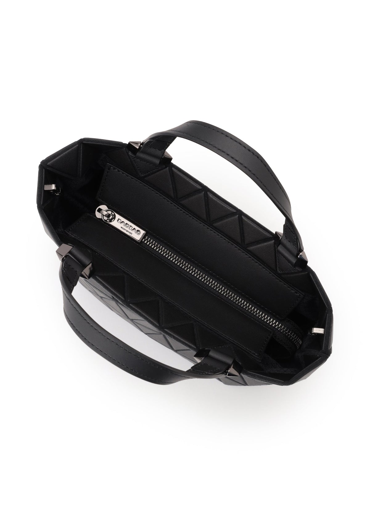 Top view of an open BAO BAO ISSEY MIYAKE CRYSTAL MATTE black quilted mini handbag with leather straps, double handles, zippered interior pocket, and a visible metal brand tag on the lining. view 5 of 7