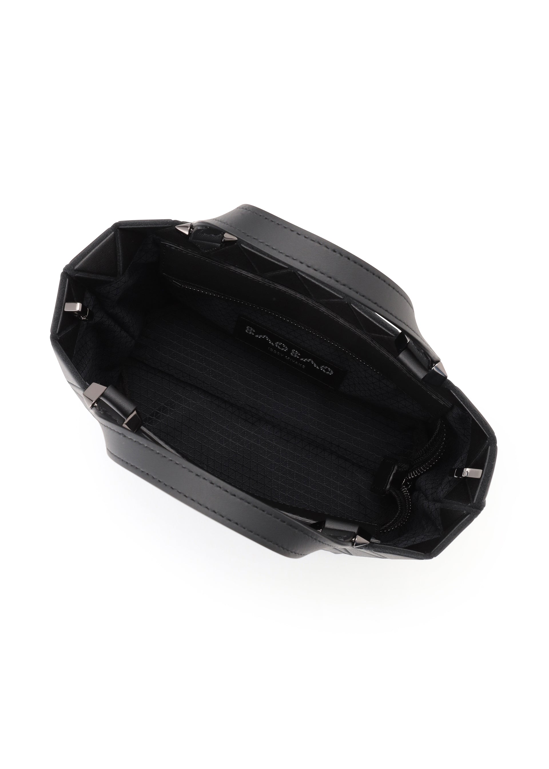 Zoomed view Top view of the CRYSTAL MATTE mini handbag by BAO BAO ISSEY MIYAKE, showing inner lining, a zippered side pocket, small logo label inside, structured sides, short handles, and elegant leather straps for a chic look.