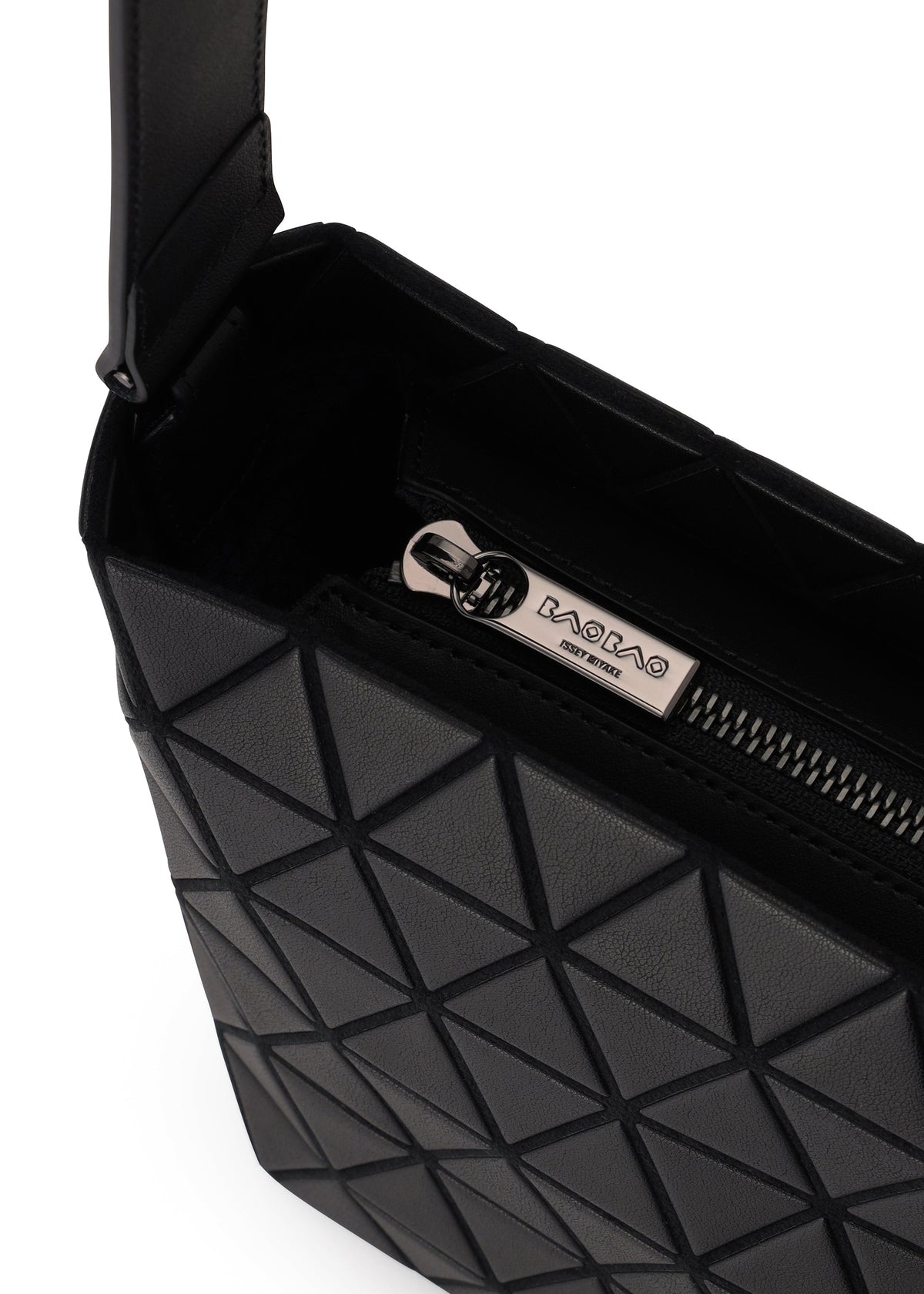 Close-up of the BAO BAO ISSEY MIYAKE CRYSTAL MATTE shoulder bag in black, featuring a geometric triangular matte texture, leather straps, and a visible silver zipper pull engraved with the brand name and MADE IN ITALY. view 3 of 5