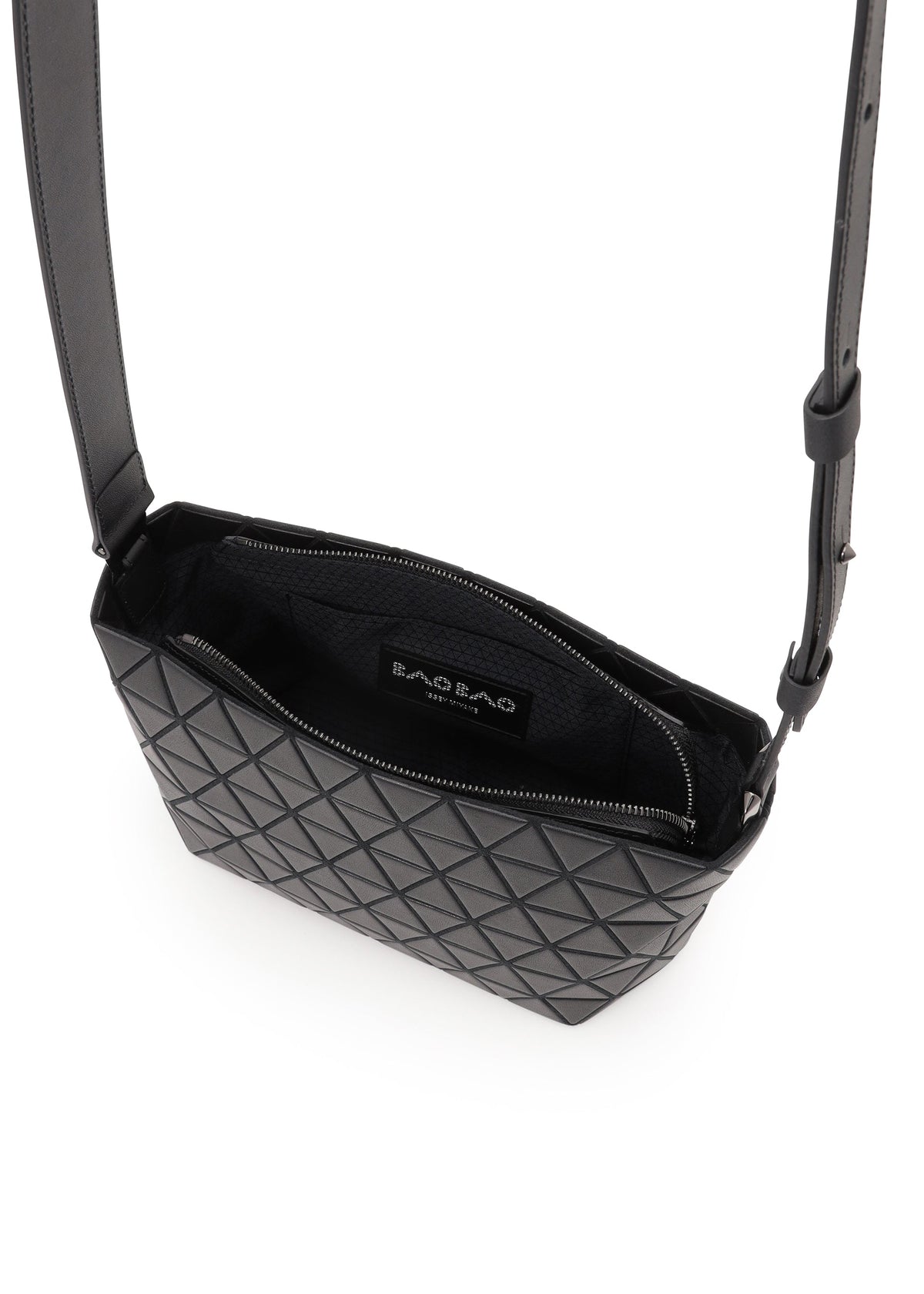 The CRYSTAL MATTE by BAO BAO ISSEY MIYAKE is a black crossbody bag with a geometric triangular matte pattern, adjustable strap, open zipper showing the black interior and visible BAO BAO label. view 6 of 7