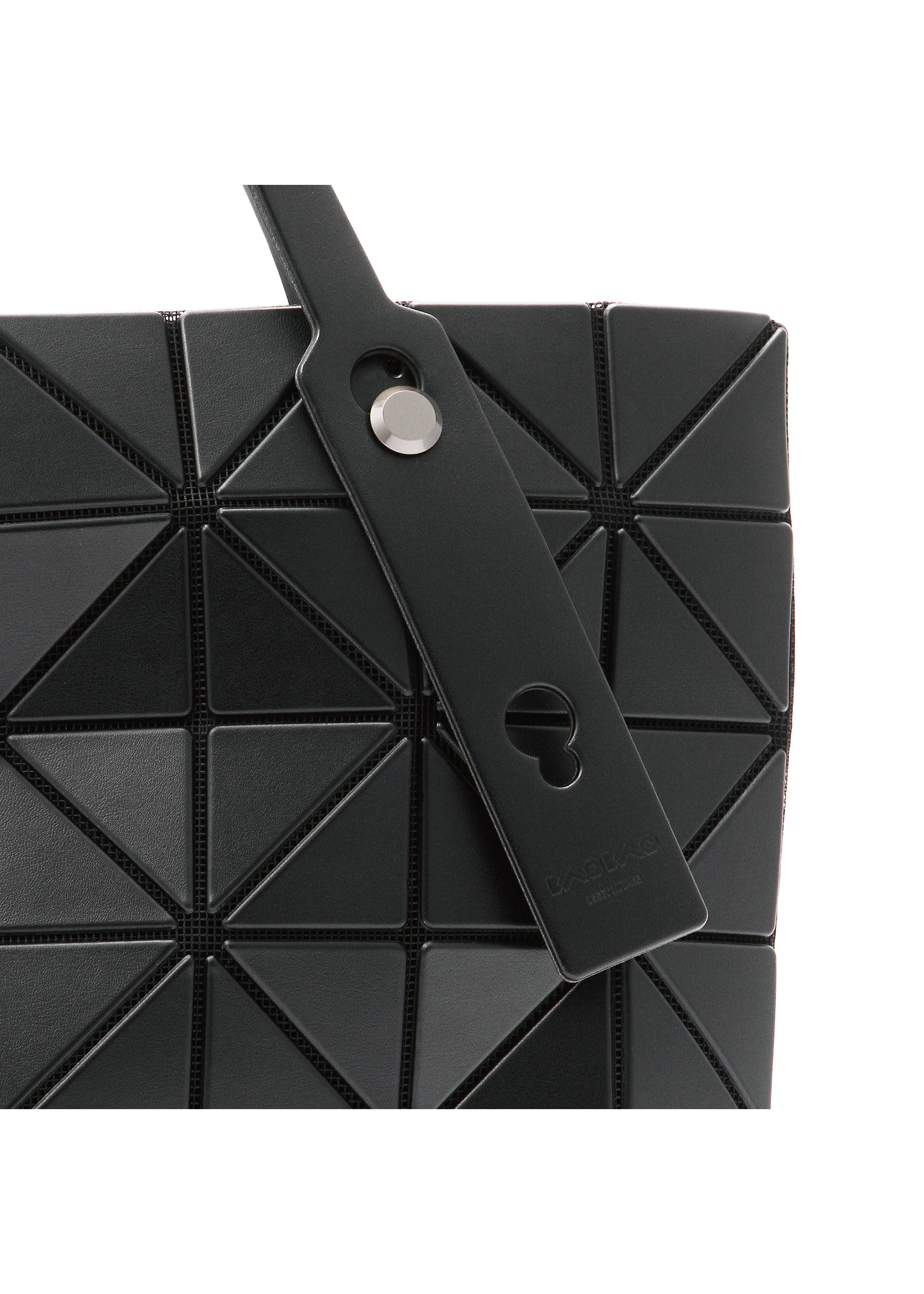 Zoomed view Close-up of the BAO BAO ISSEY MIYAKE ROCK MATTE handbag, featuring black geometric triangular panels, a strap with a round metal button and keyhole cutout, plus a gusseted bottom that fits a 13-inch laptop.
