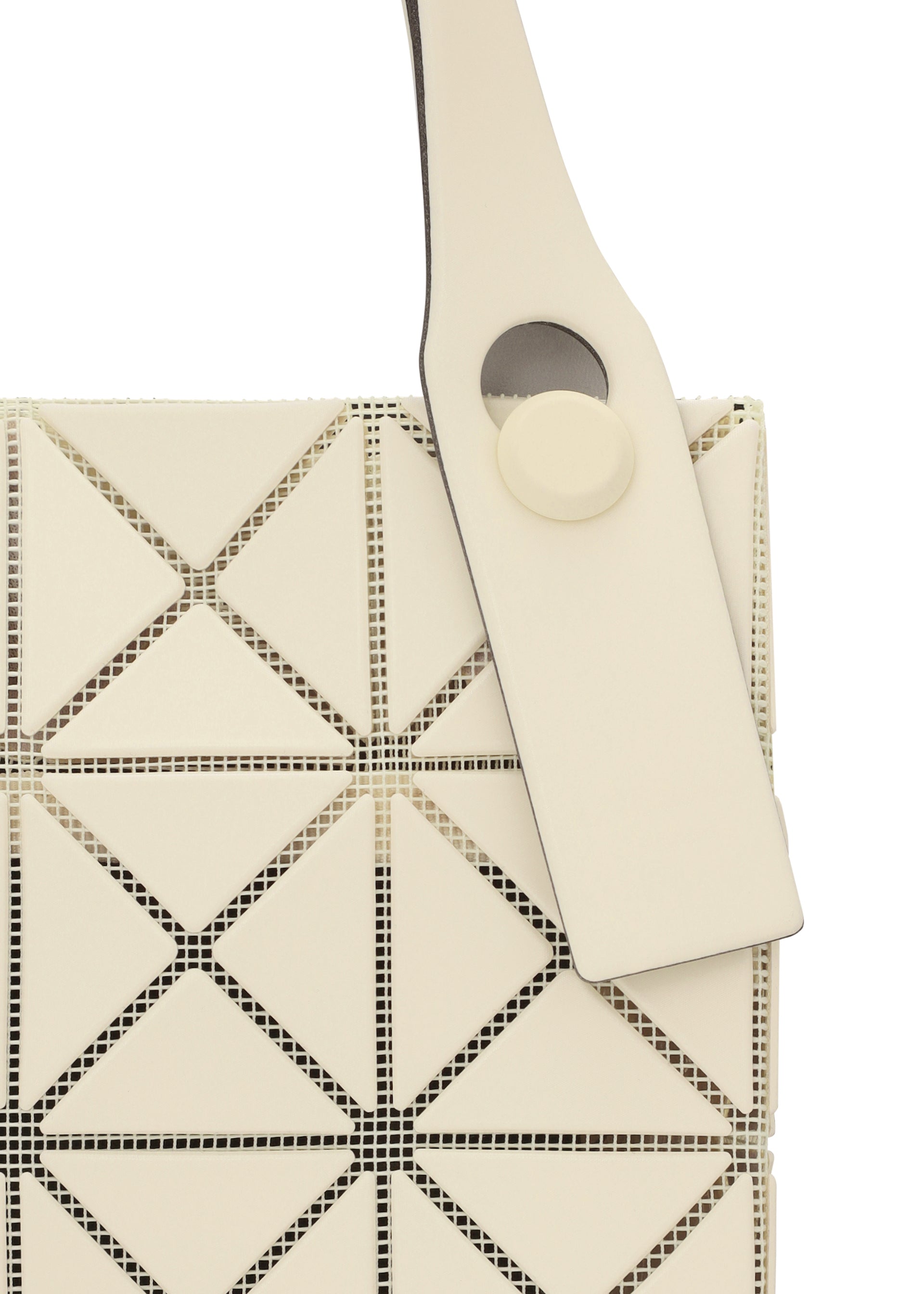 Zoomed view Close-up of the white PRISM PLUS mini tote bag by BAO BAO ISSEY MIYAKE, showcasing its geometric triangular pattern, wide strap with a round button detail, and modern textured design.