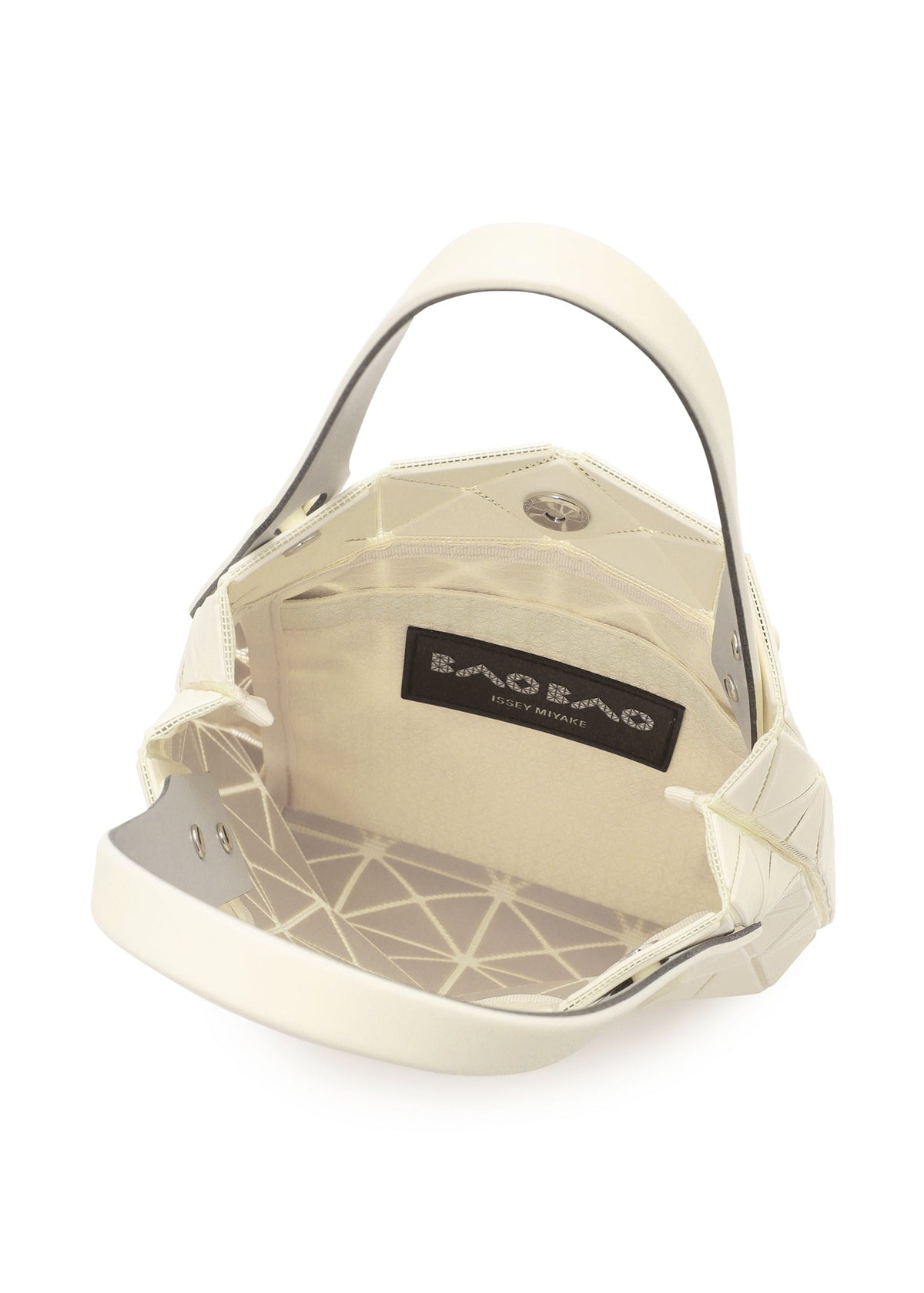 The PRISM PLUS mini tote by BAO BAO ISSEY MIYAKE is cream-colored with an open top, geometric-patterned interior, fabric lining, inner pocket, and a visible brand label. view 8 of 10