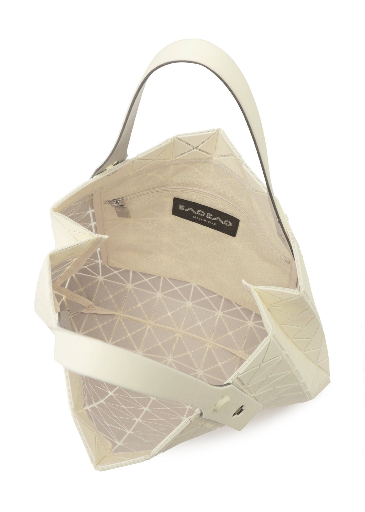 The PRISM PLUS tote by BAO BAO ISSEY MIYAKE is cream-colored with a geometric fabric texture, wide opening, beige interior, small zip pocket, BAO BAO label, and modern triangular patterns for ample storage. view 8 of 10