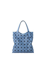 A light blue PRISM FROST tote by BAO BAO ISSEY MIYAKE, with black geometric triangles, matte finish, and two handles in a modern structured design, set against a white background. - SMOKY BLUE (no.73)