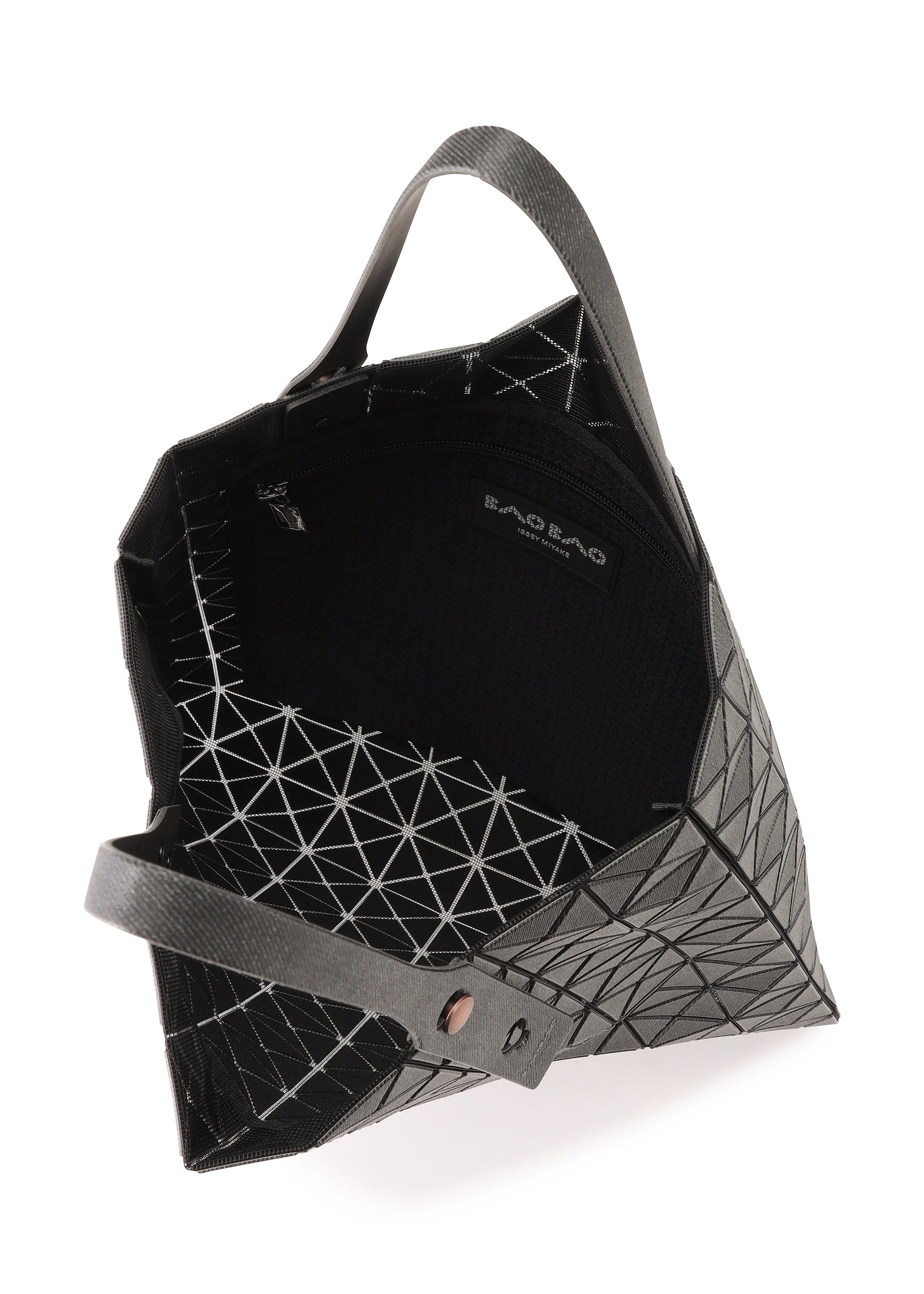 Zoomed view The PRISM DENIM by BAO BAO ISSEY MIYAKE is a geometric-patterned black tote with a textured exterior, two handles, a spacious open interior, zippered pocket, and visible brand label inside.