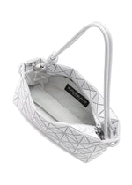 The LOOP ONE-TONE by BAO BAO ISSEY MIYAKE is a white geometric-patterned shoulder bag with zipper closure, open to show its spacious interior, carrying and adjustable straps, and an inside black brand label.