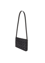 The OBLONG shoulder bag by BAO BAO ISSEY MIYAKE features a black rectangular shape, geometric triangular pattern, and long flat strap. This minimalist handbag is displayed against a plain white background.