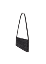 The OBLONG cross-body bag by BAO BAO ISSEY MIYAKE features a sleek, rectangular black design with a geometric triangular pattern and a long thin strap, showcased against a white background.