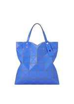 The LUCENT W COLOR tote by BAO BAO ISSEY MIYAKE features blue geometric triangular panels, two handles with a matching tag, and a stylish leather-like design that fits a 13-inch laptop—ideal for work or daily outings. - BLUE×LIGHT BLUE （no.79）