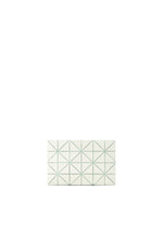 The LUCENT W COLOR by BAO BAO ISSEY MIYAKE, a rectangular white tile featuring green lines forming triangles and diamonds, is centered on a plain white background, evoking the elegance of a matte passport pouch's pattern.