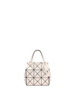 The CARAT by BAO BAO ISSEY MIYAKE is a small cream-colored handbag featuring two handles, a geometric black triangular grid pattern, and an inner pocket, shown against a plain white background. - LIGHT BEIGE (no.42)