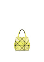 The CARAT by BAO BAO ISSEY MIYAKE is a small yellow metallic handbag with geometric patterns, black lines, two handles, an inner pocket, and a yellow tag, shown on a plain white background. - YELLOW (no.52)