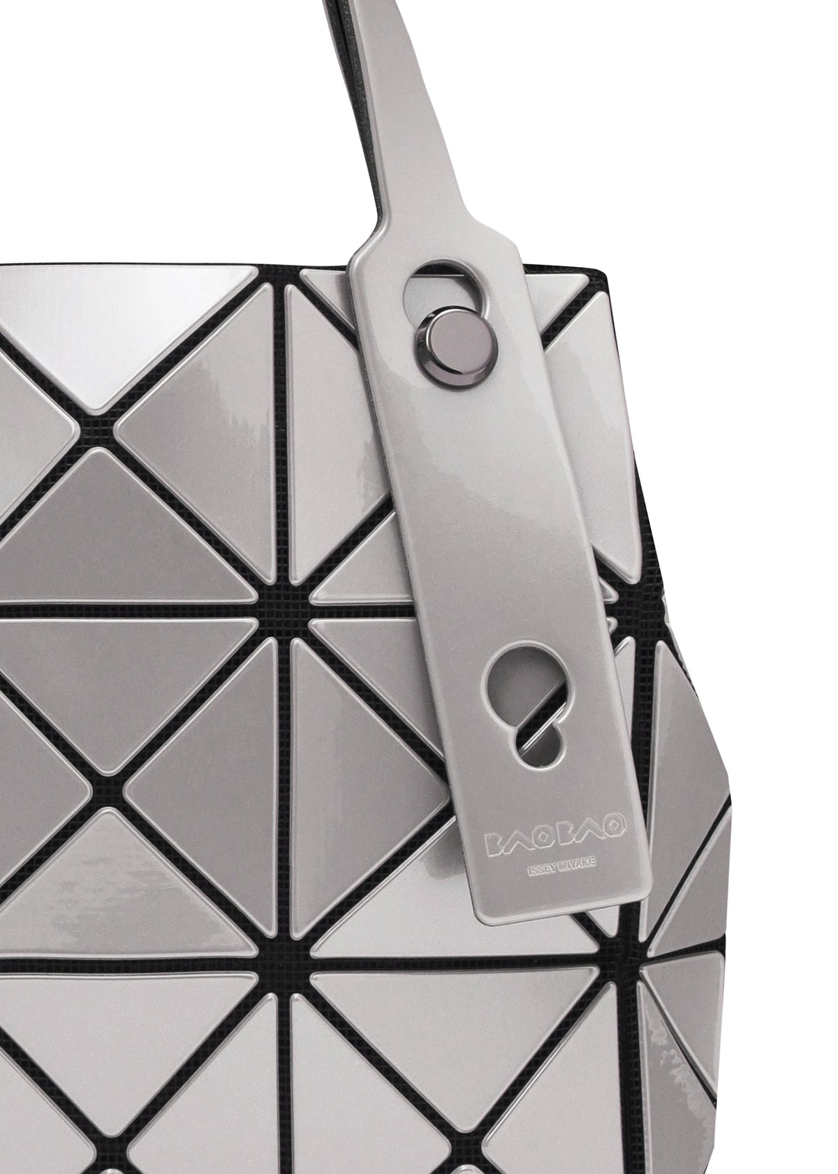 Close-up of the geometric, silver and black BAO BAO ISSEY MIYAKE CARAT handbag with metallic triangular panels, a matching tag on the handle, and an inner pocket for functionality. view 7 of 9