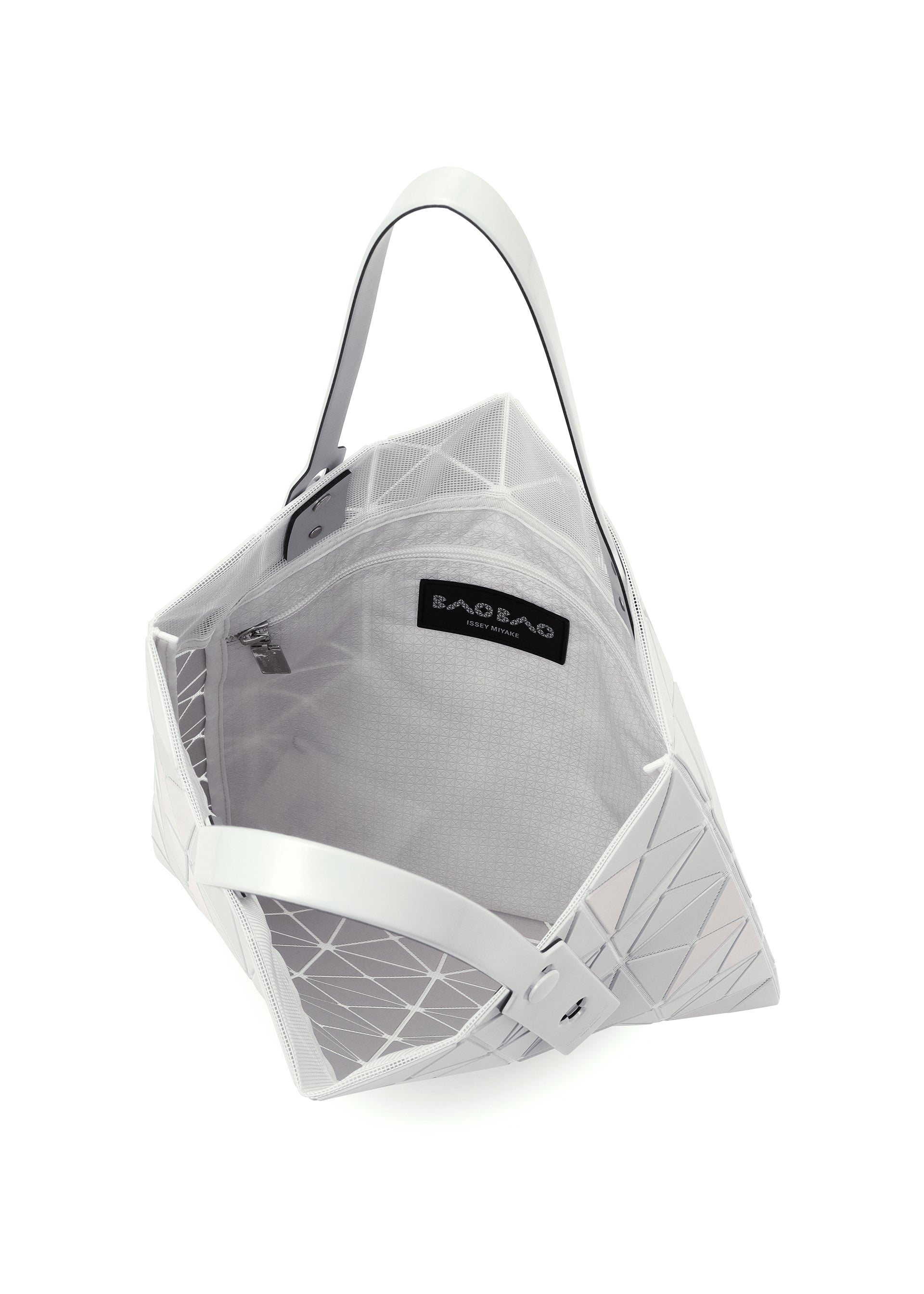 Zoomed view The LUCENT METALLIC by BAO BAO ISSEY MIYAKE is a white geometric tote with an angular, metallic look, featuring a spacious interior, zippered mesh inner pocket, black brand label, and two flat handles.