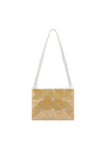 The LUCENT METALLIC by BAO BAO ISSEY MIYAKE is a rectangular shoulder bag with gold, shiny triangular panels and a white adjustable strap, shown on a plain white background. - OCHER (no.57)