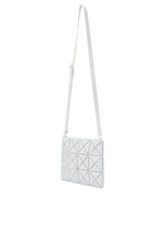 The LUCENT METALLIC by BAO BAO ISSEY MIYAKE is a white geometric shoulder bag with a triangular grid pattern, enamel finish for a metallic look, and an adjustable strap, shown against a plain white background.